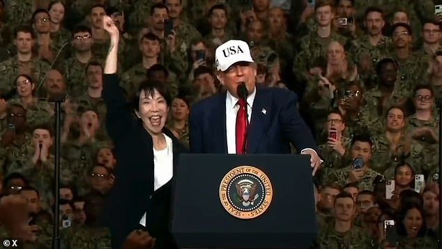 103376259-15233431-Japanese_Prime_Minister_Sanae_Takaich_jumped_for_joy_and_pumped_-m-13_17616560859.jpeg