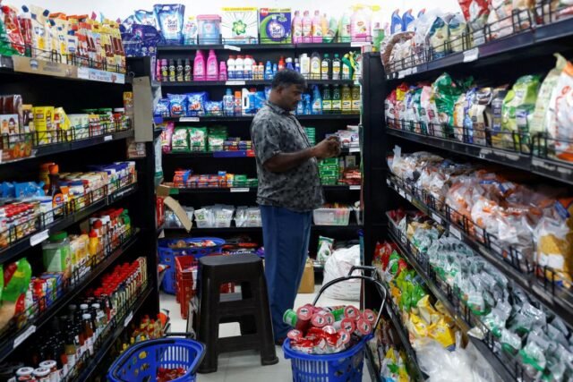 man-takes-picture-grocery-items-113377759.jpg
