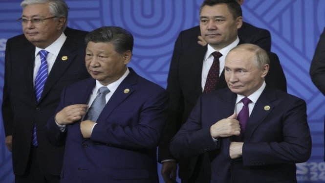 6868a01e53eb6-presiden-china-xi-jinping-dan-presiden-rusia-vladimir-putin_665_374.jpg
