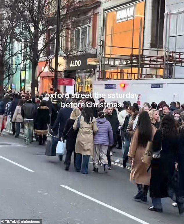 104954285-15403859-Videos_shared_on_social_media_show_shoppers_packed_shoulder_to_s-a-12_17664401923.jpeg