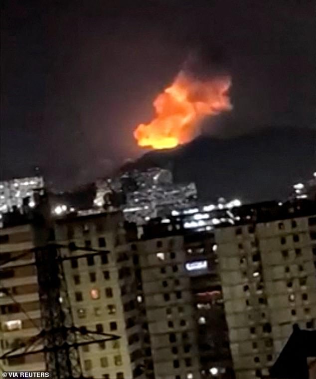 105196455-15430773-A_column_of_smoke_rises_during_multiple_explosions_in_the_early_-m-11_17674431714.jpeg