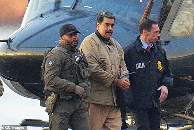105258471-15436943-Nicolas_Maduro_is_seen_in_handcuffs_after_landing_at_a_Manhattan-m-3_176766301494.jpeg
