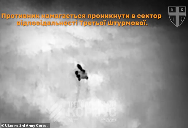 105569203-15469623-A_Ukrainian_robot_armed_with_a_heavy_machine_gun_held_off_repeat-m-2_176856387873.jpeg
