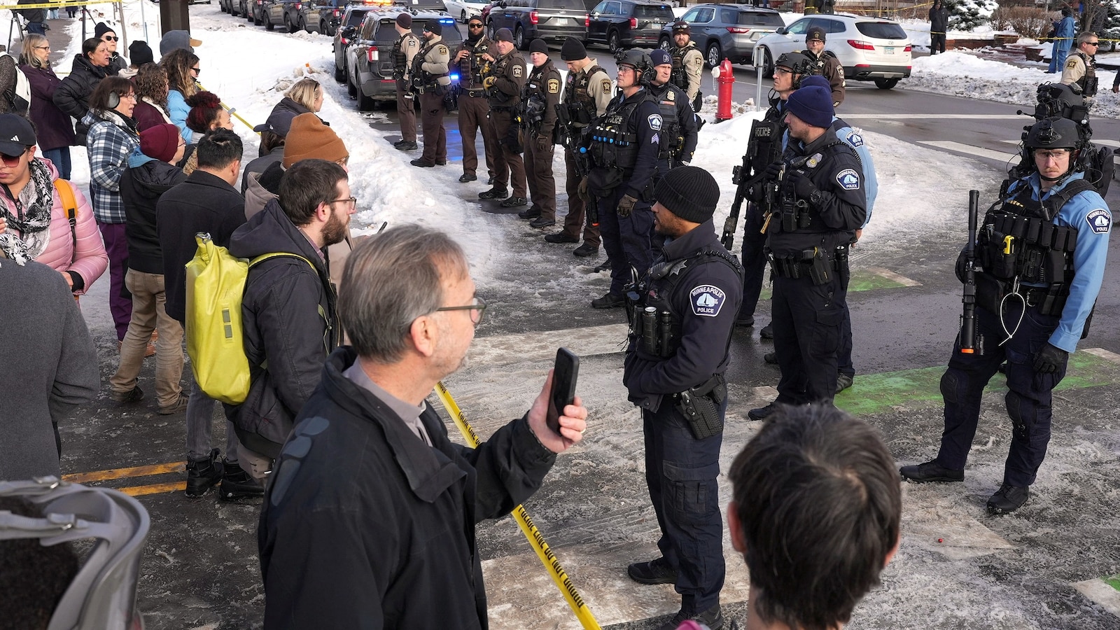 minneapolis-protesters-line-rt-jt-260107_1767822306766_hpMain_2_16x9.jpg