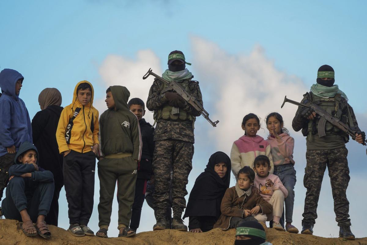 palestinian-children-stand-watch-hamas-98846613-e1771800323290.jpg